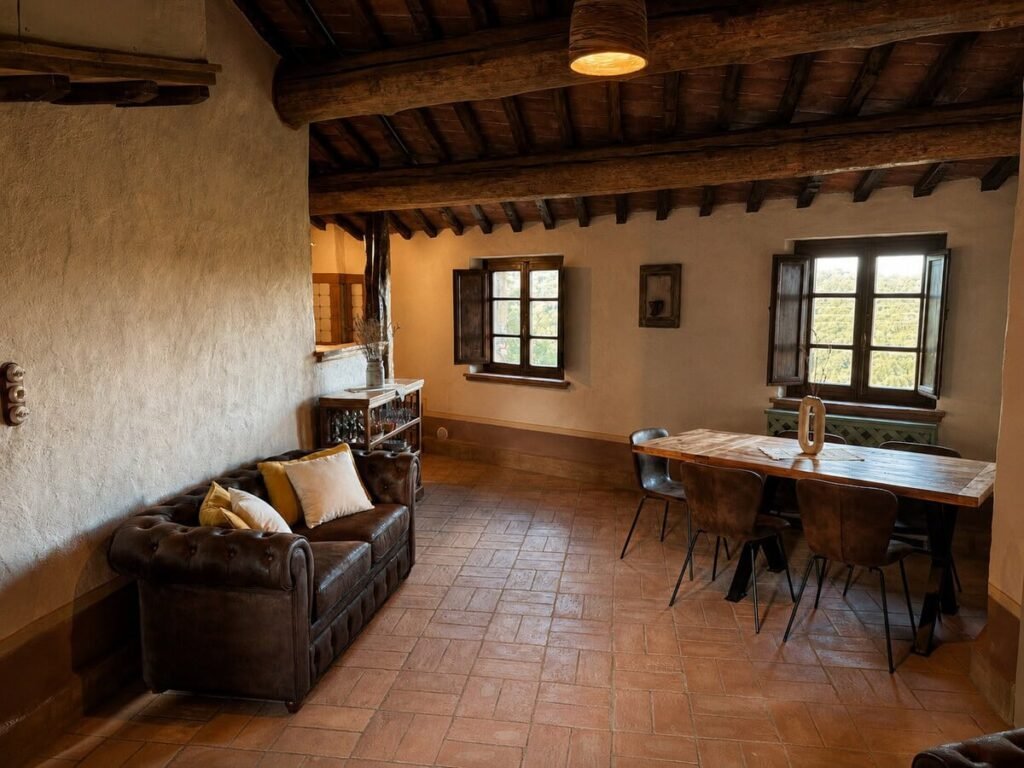 Zona giorno e pranzo con divano e tavolo nell'appartamento Il belvedere, Borgo Braila, Umbria